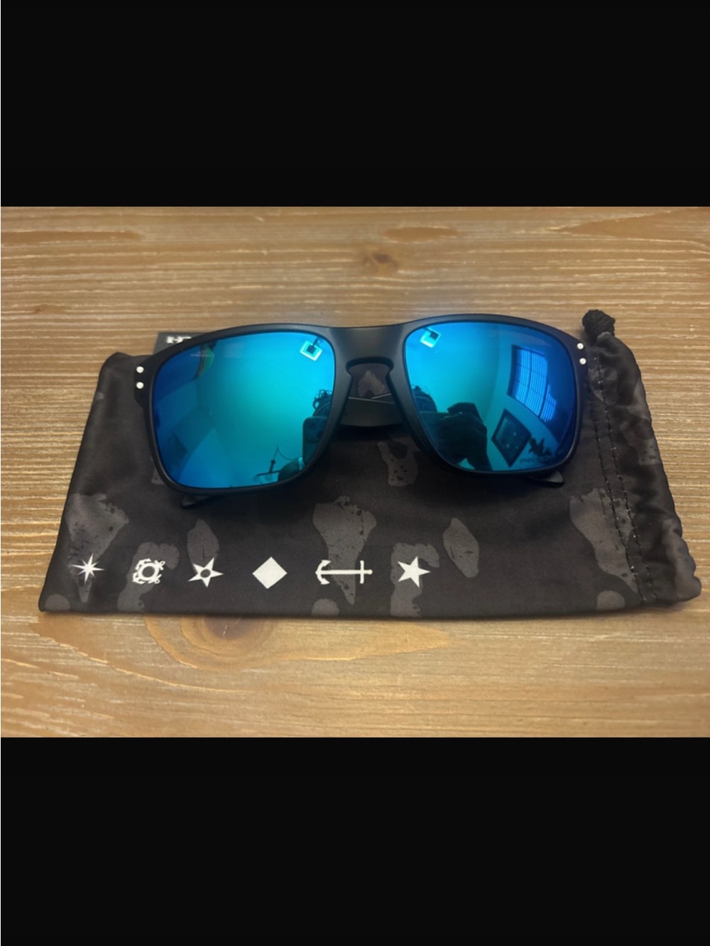 Oakley Men's Blue Mirrored Polarized Sunglasses with Black Frame